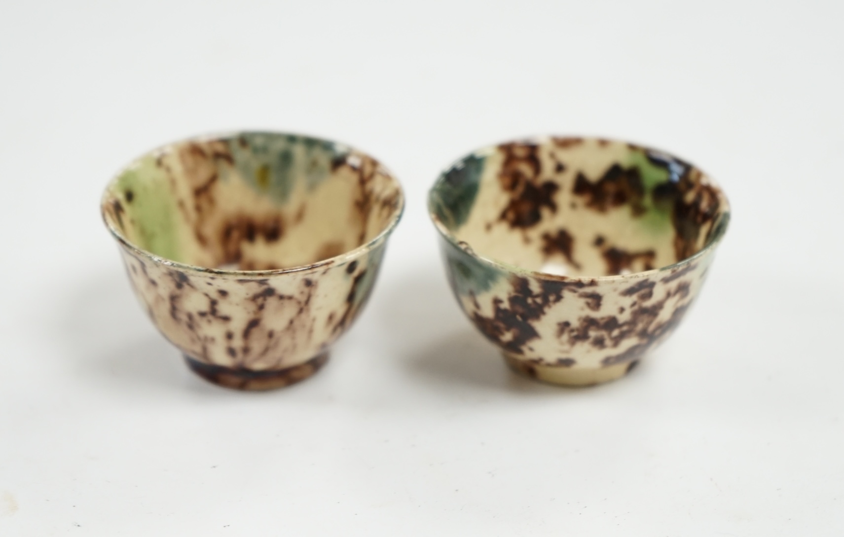 A pair of 18th century Whieldon-type miniature bowls, top rim 4.5cm diameter. Condition - some small chips to base